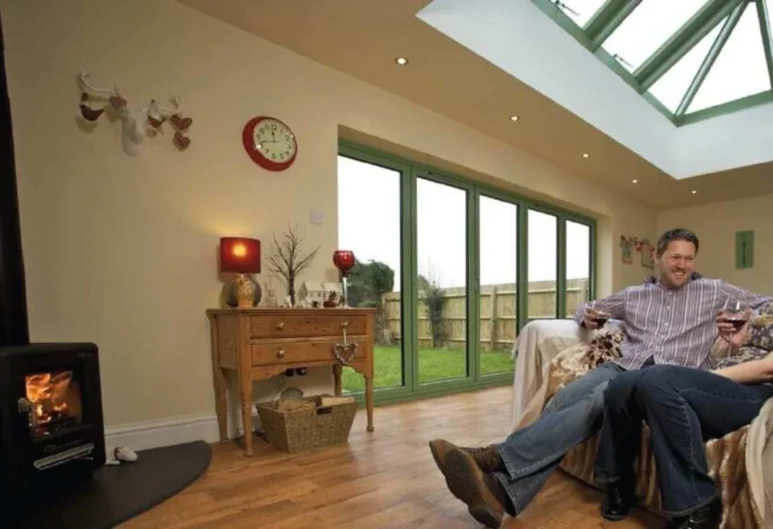 A scene with a set of our Aluminium Bi-Folding Doors and Glazed Rooflight